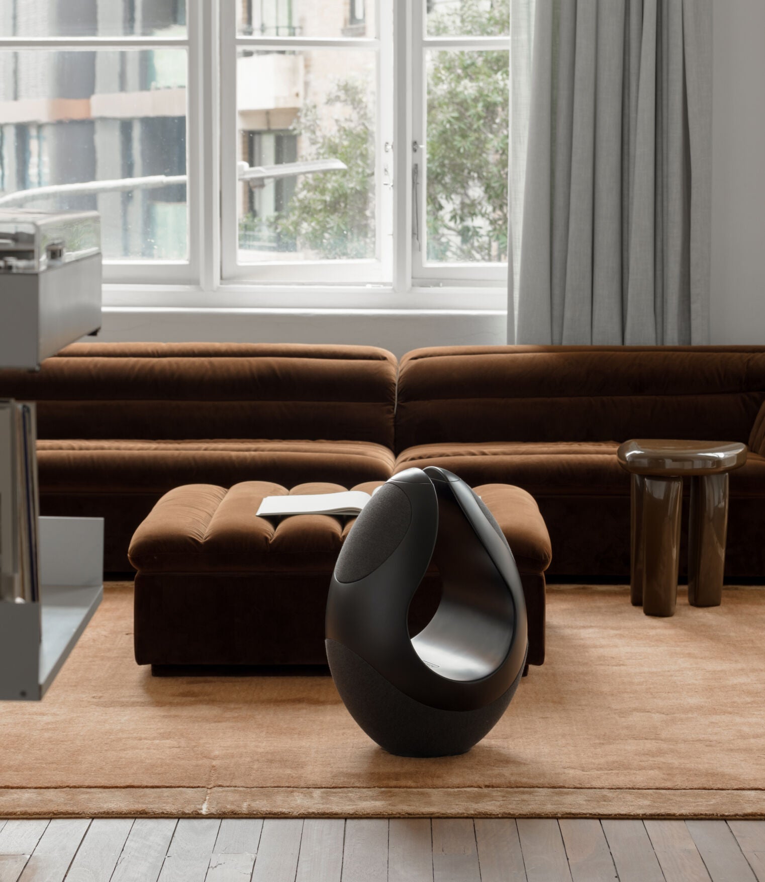 Pantheone I luxury wireless speaker in a modern living room