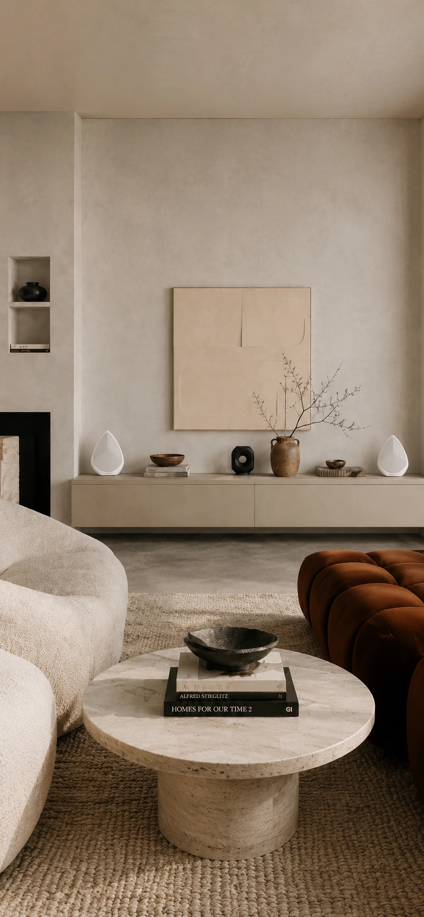 Modern living room with neutral color palette, furniture, and Obsidian wireless speakers.