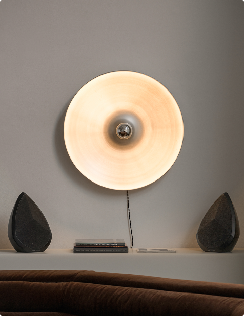 black pantheone Obsidian speakers paired together in a stylish, contemporary living space, demonstrating stereo pairing