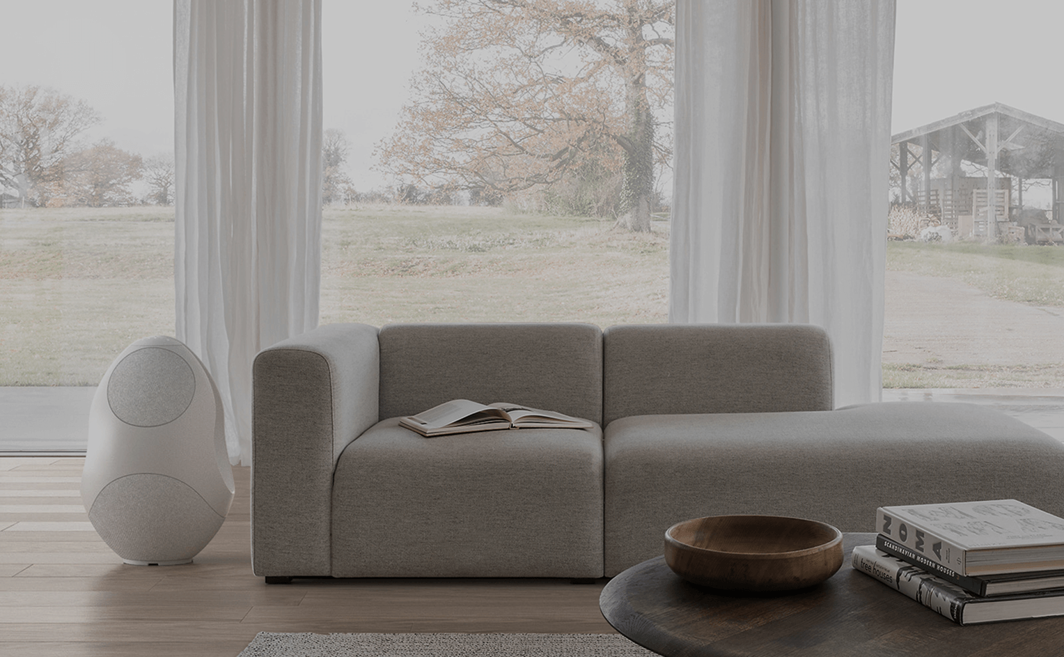 pantheone I white sculptural wireless speaker in luxurious living room