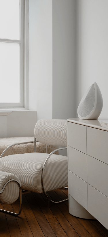 obsidian wifi speaker on a cabinet in a bedroom