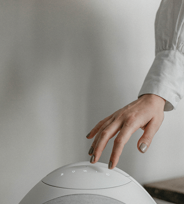 Top view of Pantheone I white speaker showing touch-sensitive interface