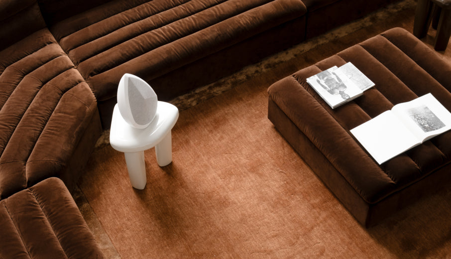 Obsidian Bluetooth speaker on a chair 