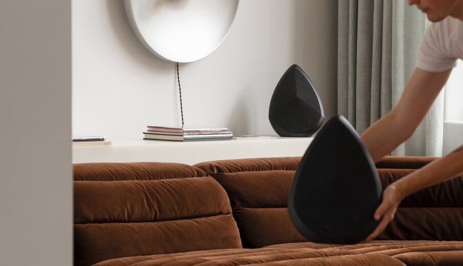 Holding the Obsidian wireless speaker 