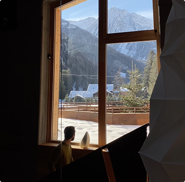 walking up the stairs looking at the obsidian speaker and the view