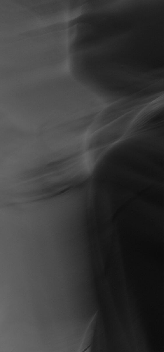 Abstract black and grey motion blur representing the flow and energy of sound.