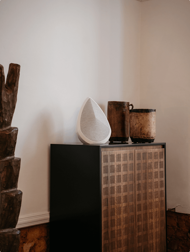 Obsidian white luxury speaker on a bedroom cabinet