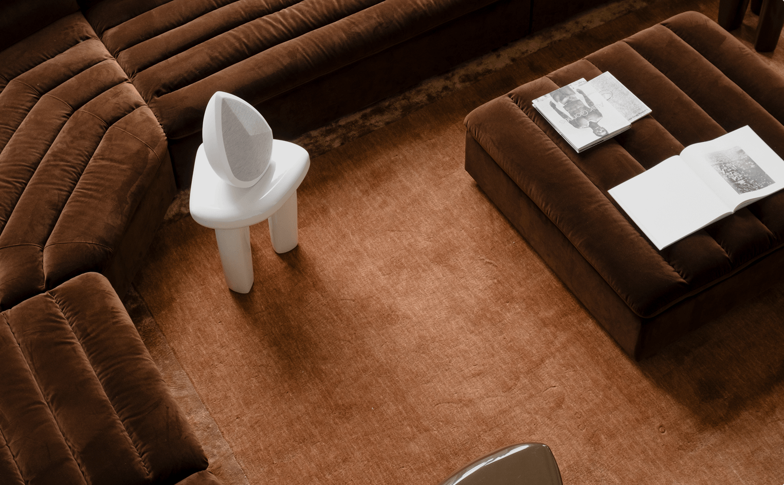 obsidian white bluetooth speaker on a chair 