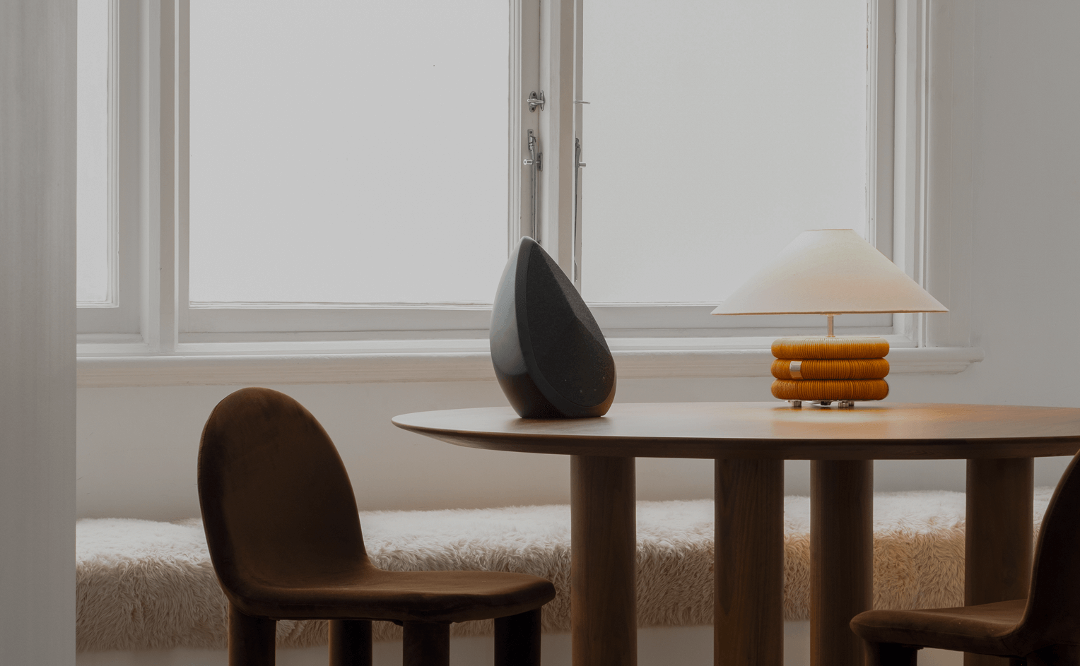 Obsidian black portable speaker on a table 