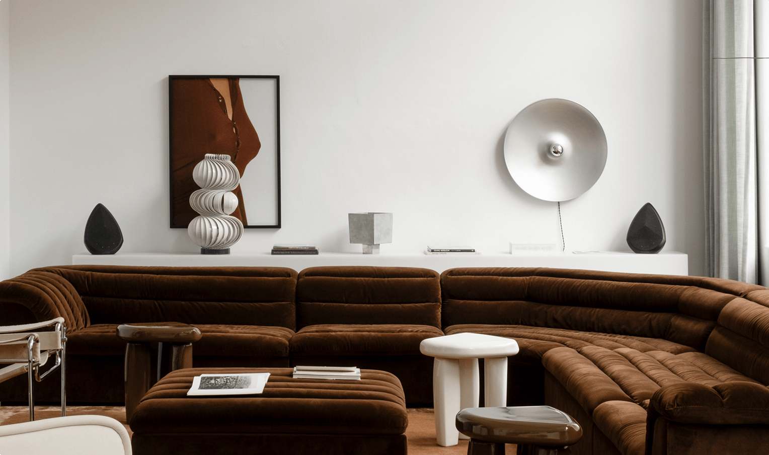 Two Pantheone Obsidian wireless speakers demonstrating stereo listening in a modern living room 
