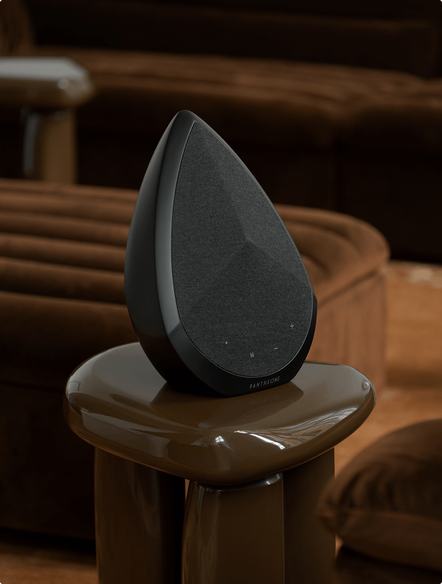 Pantheone Obsidian portable speaker on a glossy side table
