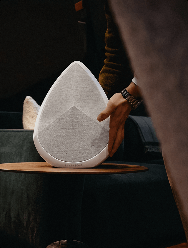 The Obsidian wifi and Bluetooth speaker placed on a side table