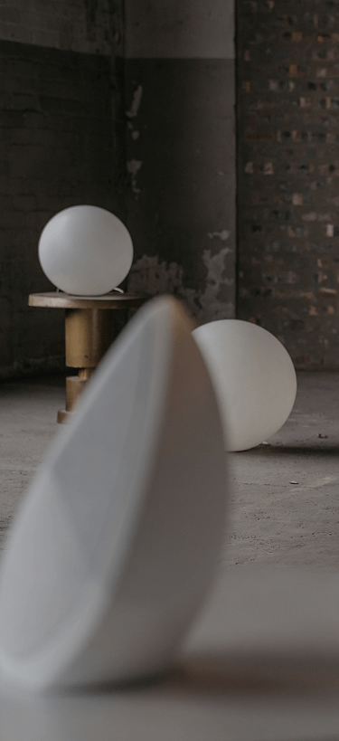 White obsidian portable speaker with designer lights in the backround