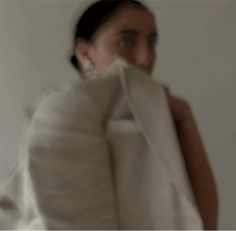 A woman holding a coat