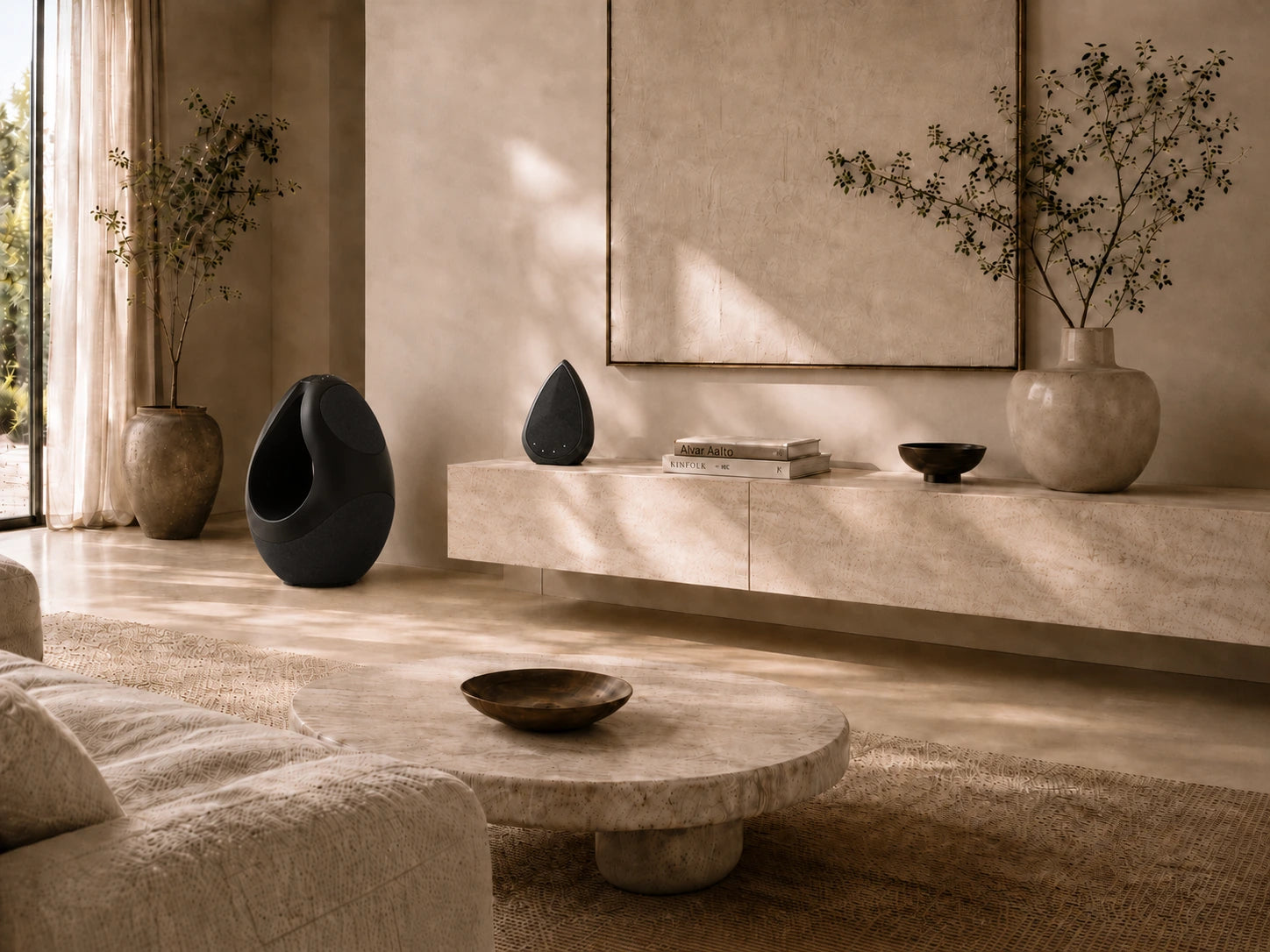 Modern living room with neutral decor, including a TV console and decorative vases.