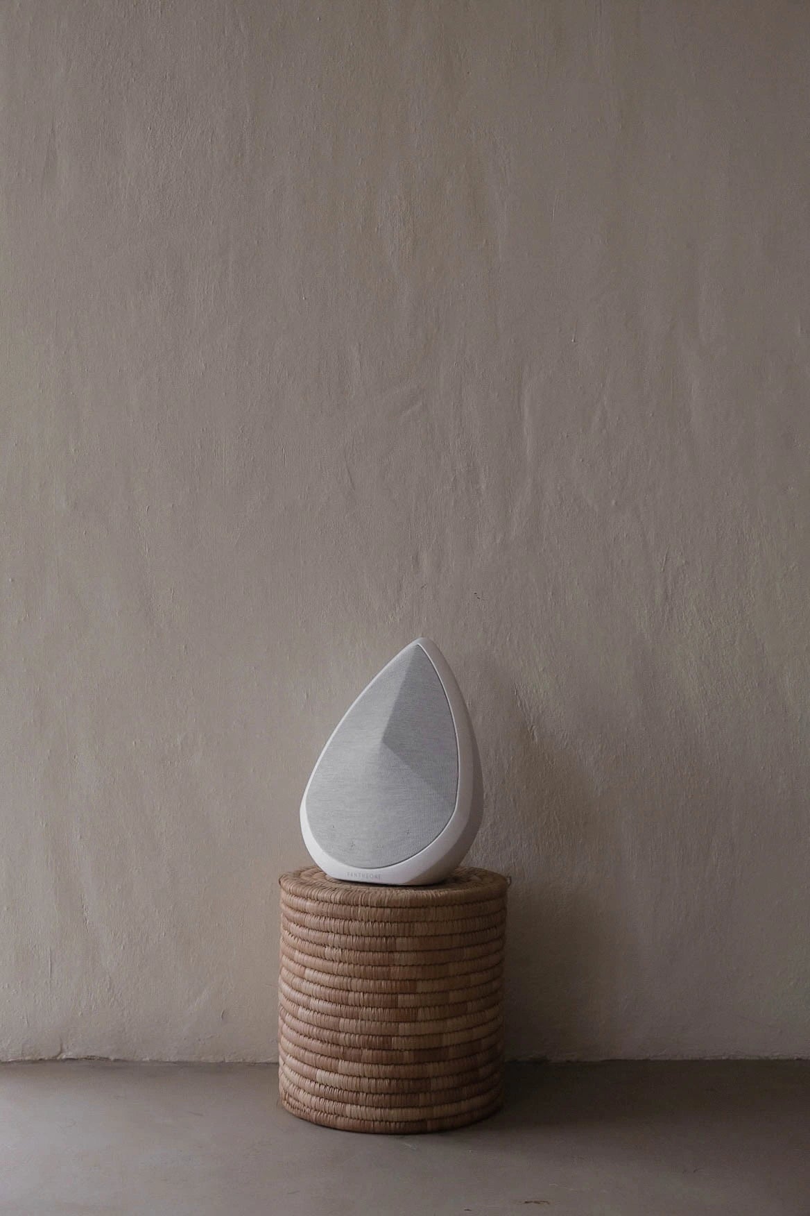 Pantheone Obsidian Portable Speaker on a stylish stool