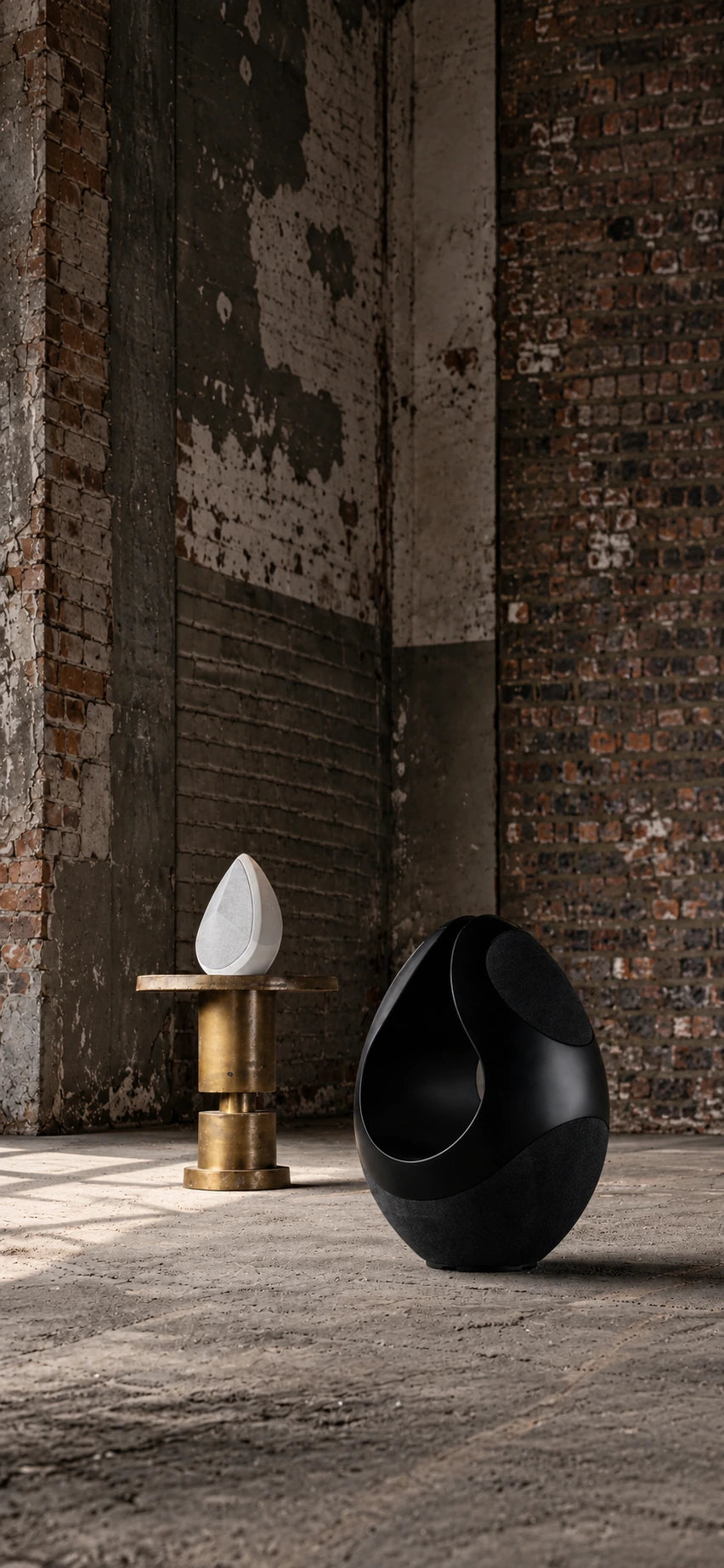 Pantheone I and Obsidian wireless speaker in an industrial space.