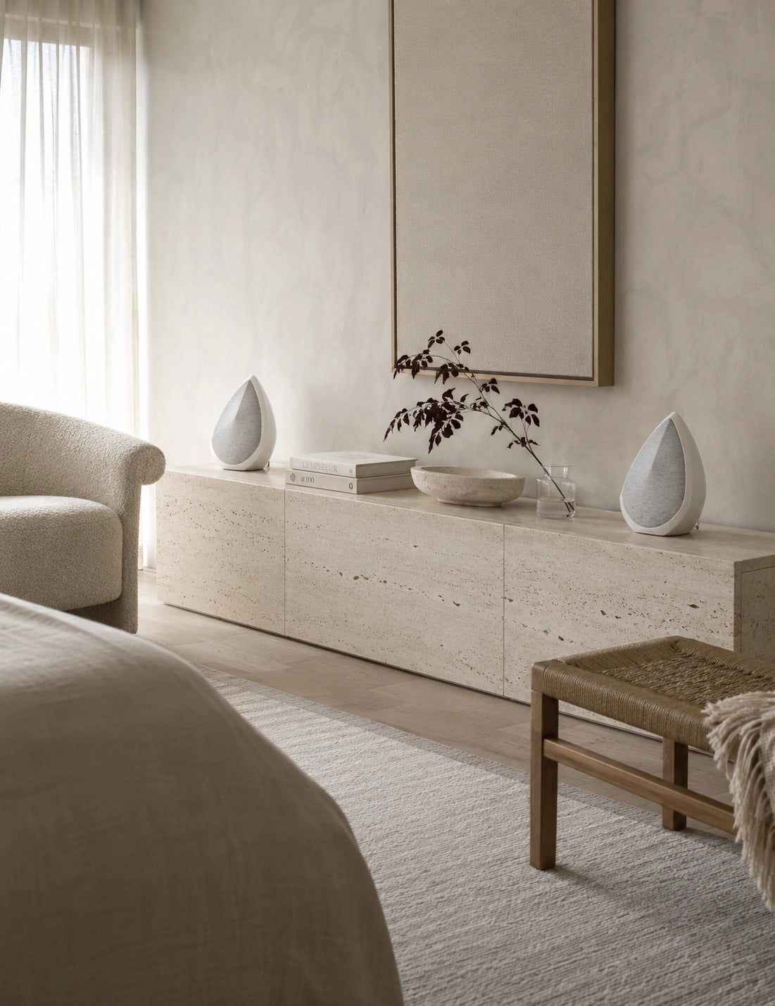 Modern bedroom with neutral tones, furniture, and decor elements.
